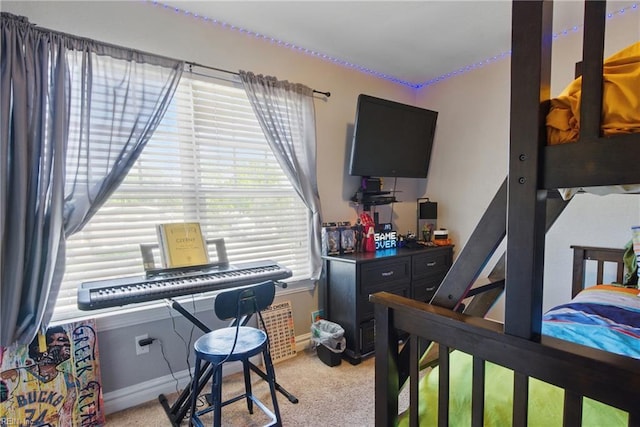 bedroom featuring baseboards and carpet flooring