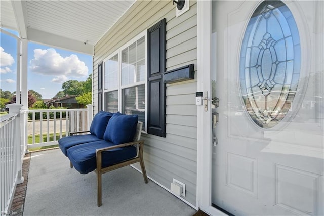 doorway to property featuring covered porch