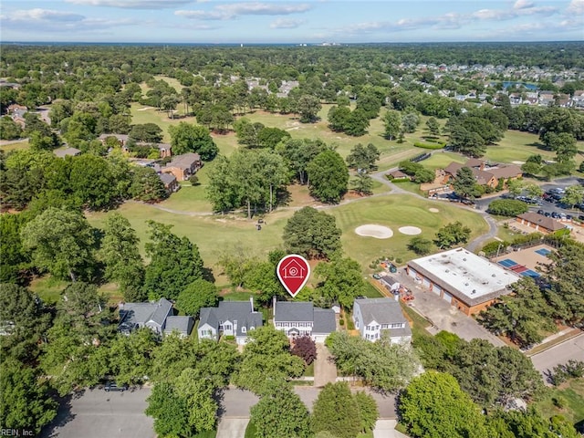 aerial view of residential area featuring a golf club
