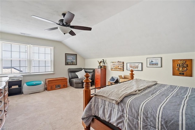 carpeted bedroom featuring lofted ceiling and a ceiling fan