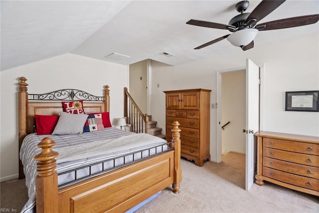 bedroom featuring light colored carpet, ceiling fan, and vaulted ceiling