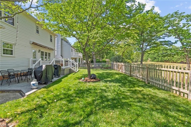 view of yard with a deck and a patio area
