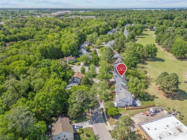 aerial perspective of suburban area with a forest
