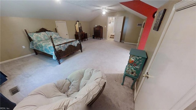 carpeted bedroom with vaulted ceiling and baseboards