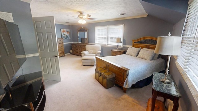 carpeted bedroom featuring ornamental molding, a textured ceiling, a ceiling fan, baseboards, and lofted ceiling
