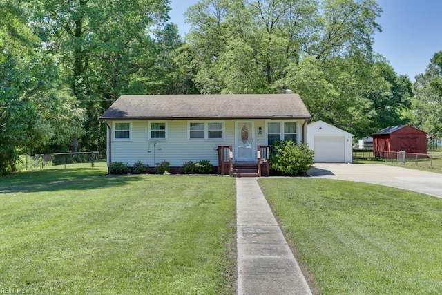 1040 Cox Ave, Chesapeake, VA 23323 - view of front of property with concrete driveway, a garage, an outbuilding, and a shingled roof