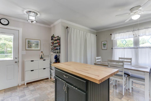 1040 Cox Ave, Chesapeake, VA 23323 - kitchen with butcher block countertops, stone finish floors, ornamental molding, a ceiling fan, and a kitchen island