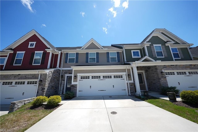 3432 Foxglove Dr, Toano, VA 23168 - townhome / multi-family property featuring stone siding, an attached garage, and concrete driveway