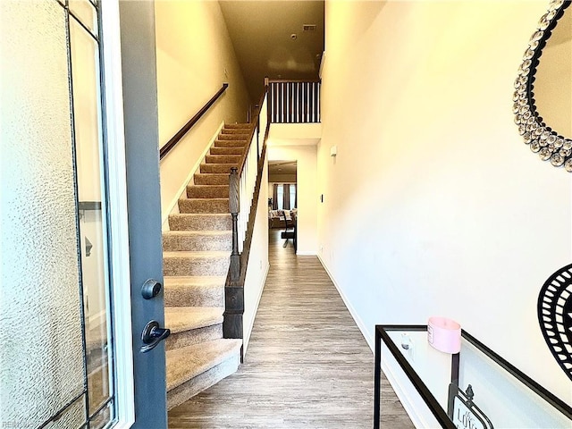 3432 Foxglove Dr, Toano, VA 23168 - foyer featuring wood finished floors, stairway, and a high ceiling