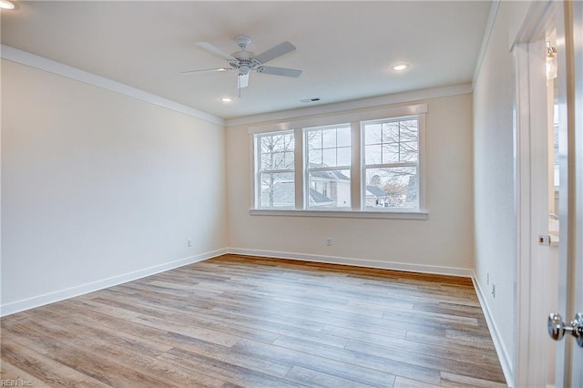 unfurnished room with ceiling fan, crown molding, wood finished floors, and a healthy amount of sunlight