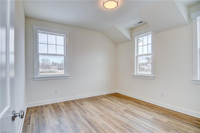 bonus room featuring wood finished floors and baseboards