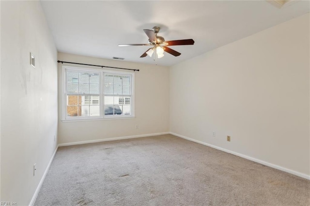 unfurnished room with carpet floors, ceiling fan, and baseboards