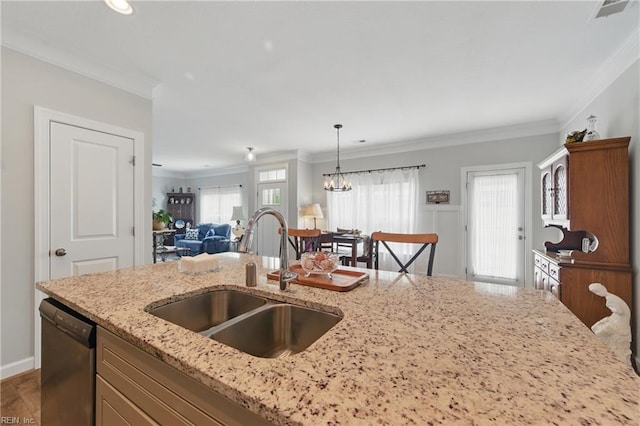 kitchen featuring a sink, open floor plan, crown molding, dishwasher, and healthy amount of natural light