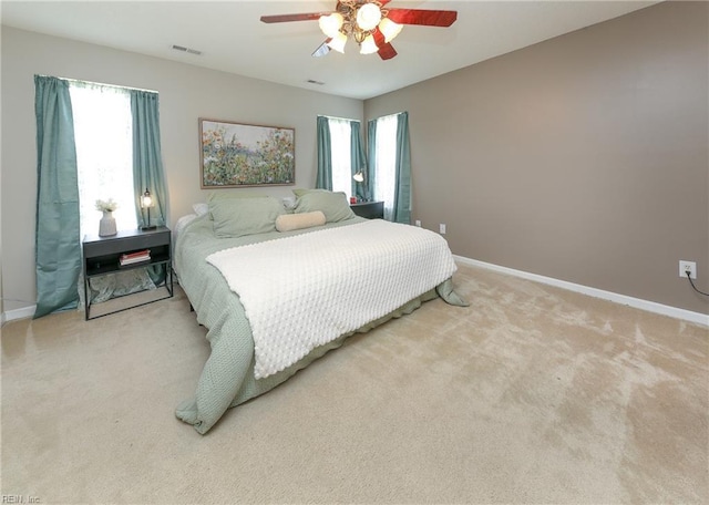 1242 Woods Edge Cir, Suffolk, VA 23434 - carpeted bedroom with baseboards and a ceiling fan