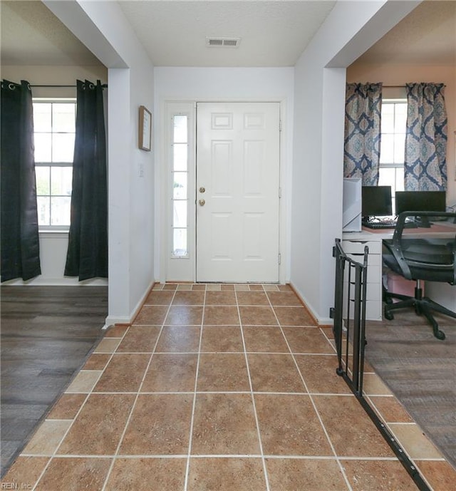 1242 Woods Edge Cir, Suffolk, VA 23434 - entryway with plenty of natural light and baseboards