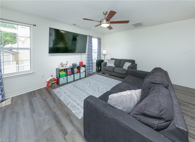 1242 Woods Edge Cir, Suffolk, VA 23434 - living room with wood finished floors, ceiling fan, plenty of natural light, and baseboards