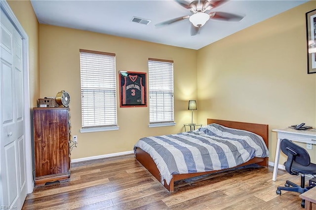 1400 Granby St Unit 309, Norfolk, VA 23510 - bedroom with wood finished floors, multiple windows, baseboards, and ceiling fan