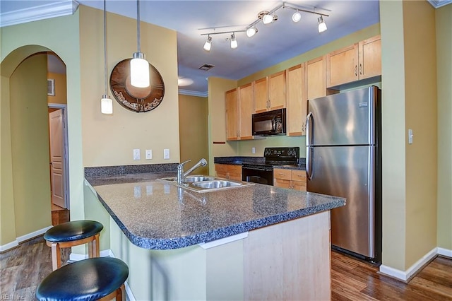1400 Granby St Unit 309, Norfolk, VA 23510 - kitchen featuring black appliances, dark countertops, a sink, baseboards, and a peninsula