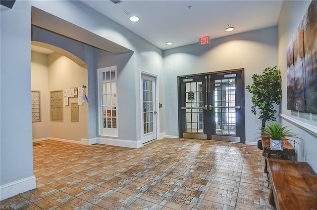 1400 Granby St Unit 309, Norfolk, VA 23510 - foyer featuring brick floors, arched walkways, baseboards, french doors, and recessed lighting