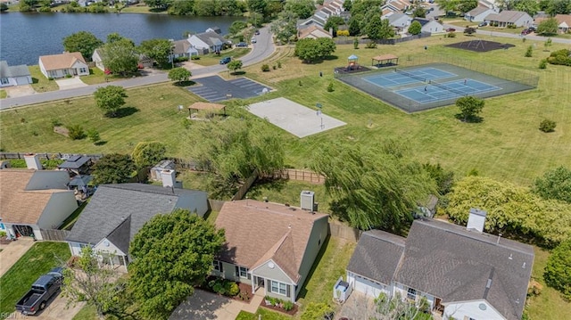 aerial view of residential area featuring a large body of water