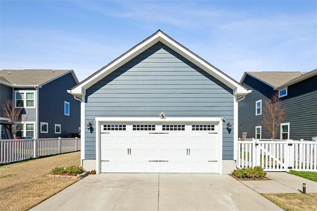 909 Porte Crayon St, Chesapeake, VA 23323 - view of front of home with a garage, fence, and driveway