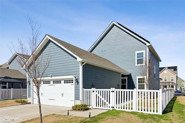 909 Porte Crayon St, Chesapeake, VA 23323 - view of property exterior featuring an attached garage, fence, driveway, and a gate