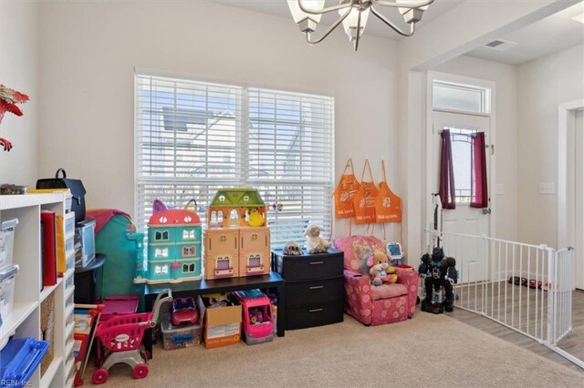 909 Porte Crayon St, Chesapeake, VA 23323 - playroom featuring a chandelier and carpet floors