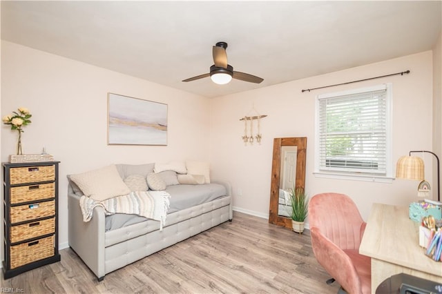 bedroom featuring light wood-style floors, baseboards, and ceiling fan