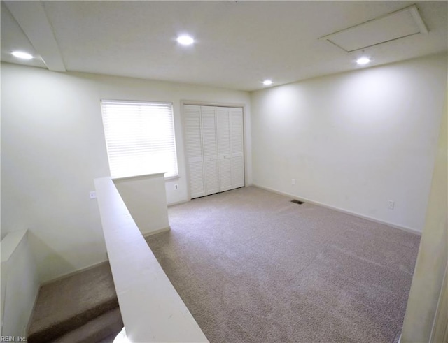 spare room with carpet and recessed lighting