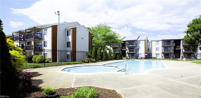 community pool featuring fence