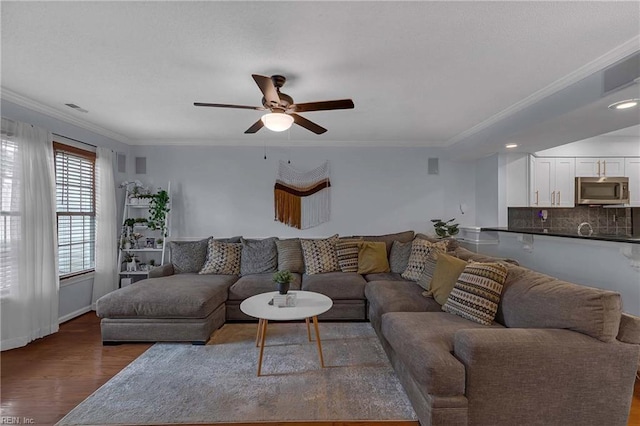112 Two Turkey Run, Yorktown, VA 23692 - living room with wood finished floors, ceiling fan, ornamental molding, baseboards, and recessed lighting