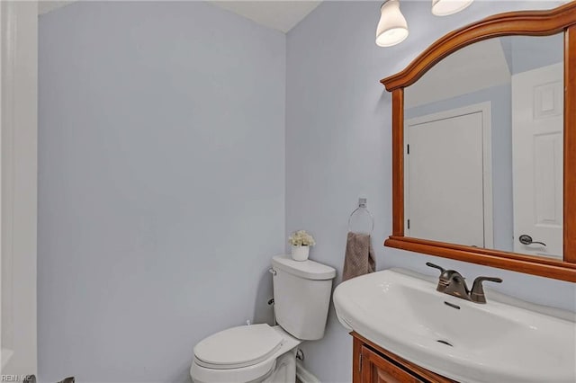 112 Two Turkey Run, Yorktown, VA 23692 - half bathroom with toilet, baseboards, and vanity