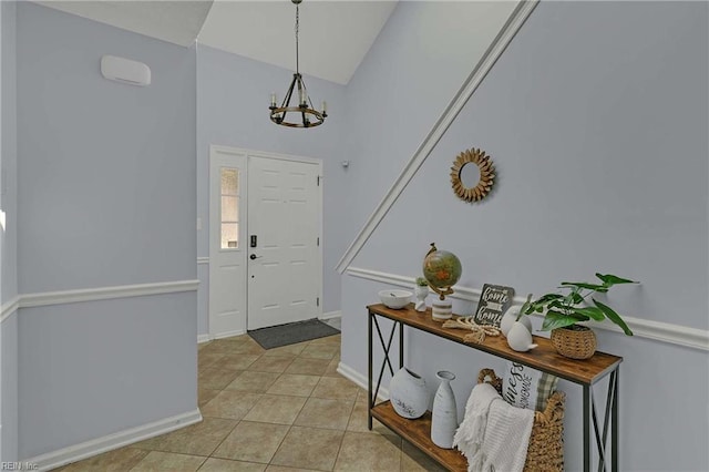 112 Two Turkey Run, Yorktown, VA 23692 - entrance foyer featuring a chandelier, light tile patterned floors, lofted ceiling, and baseboards