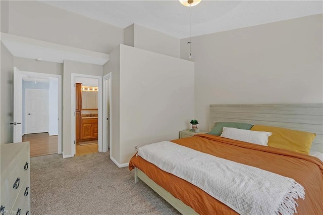 112 Two Turkey Run, Yorktown, VA 23692 - bedroom featuring carpet, baseboards, ensuite bath, and a sink