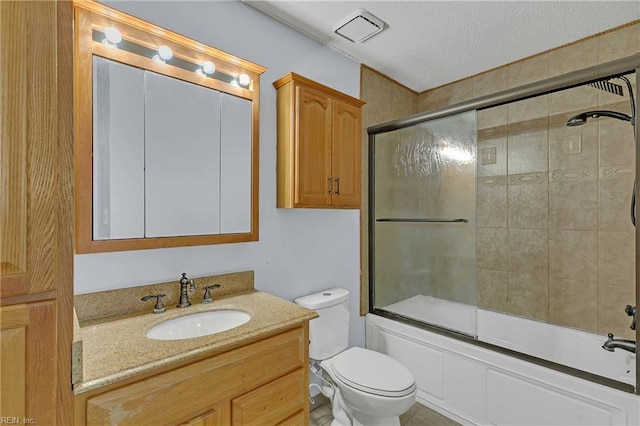 112 Two Turkey Run, Yorktown, VA 23692 - bathroom with a textured ceiling, bath / shower combo with glass door, vanity, and toilet