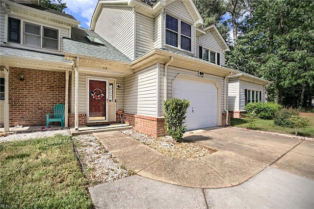 112 Two Turkey Run, Yorktown, VA 23692 - view of front facade featuring a garage, brick siding, and driveway