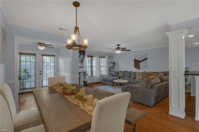 112 Two Turkey Run, Yorktown, VA 23692 - dining room featuring a ceiling fan, wood finished floors, ornamental molding, french doors, and decorative columns