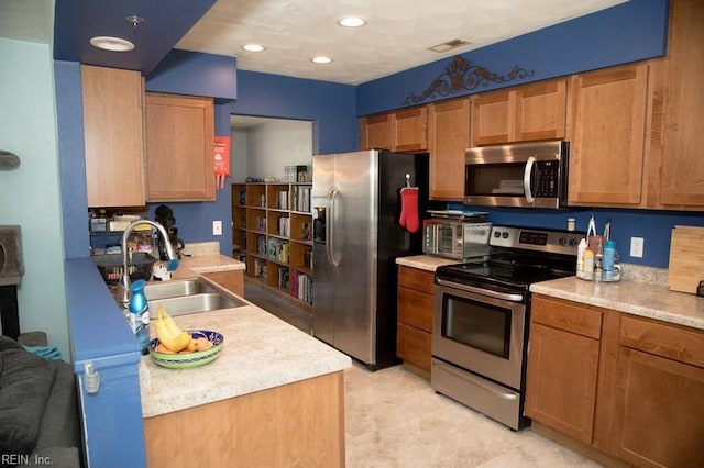 1132 Van Loen Dr, Virginia Beach, VA 23453 - kitchen featuring appliances with stainless steel finishes, a sink, and light countertops