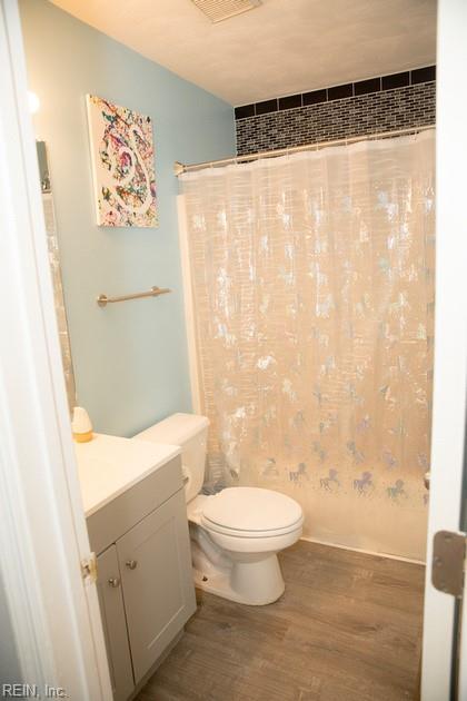 1132 Van Loen Dr, Virginia Beach, VA 23453 - bathroom with wood finished floors, toilet, and vanity