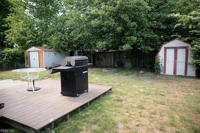 1132 Van Loen Dr, Virginia Beach, VA 23453 - view of yard featuring a storage unit, a deck, an outbuilding, and a fire pit