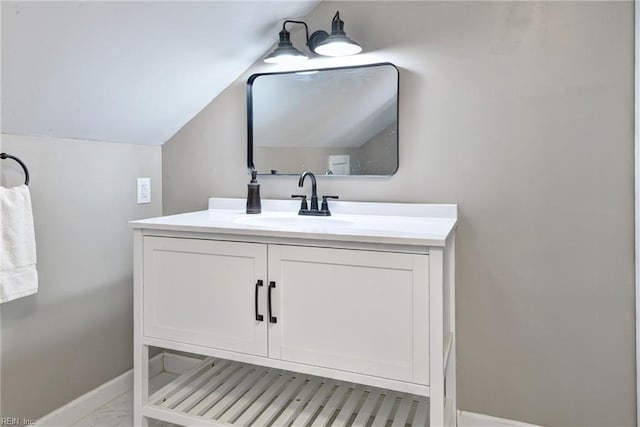 421 2nd St, West Point, VA 23181 - bathroom featuring baseboards, vanity, lofted ceiling, and marble look tile flooring