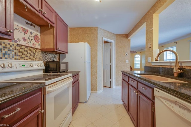 4813 Shallowford Cir, Virginia Beach, VA 23462 - kitchen with white appliances, a sink, wallpapered walls, light tile patterned floors, and dark stone counters