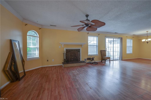 4813 Shallowford Cir, Virginia Beach, VA 23462 - unfurnished living room featuring a chandelier, wood finished floors, a ceiling fan, a fireplace with raised hearth, and crown molding