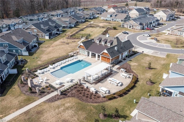 aerial view of residential area featuring a pool