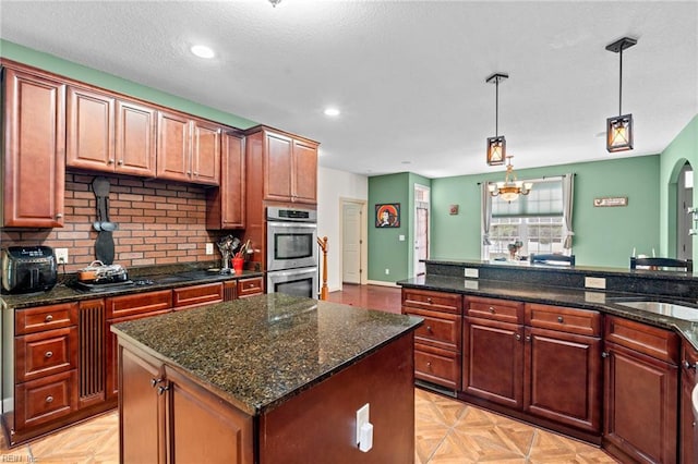 2234 Creekway Dr, Smithfield, VA 23430 - kitchen with stainless steel double oven, pendant lighting, a center island, recessed lighting, and a sink