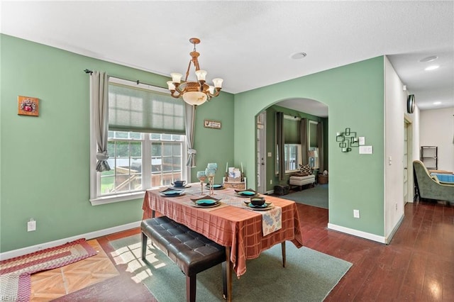 2234 Creekway Dr, Smithfield, VA 23430 - dining room with arched walkways, baseboards, a chandelier, and wood finished floors