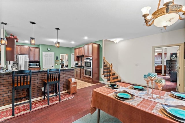 2234 Creekway Dr, Smithfield, VA 23430 - living room featuring dark wood finished floors, recessed lighting, and stairway