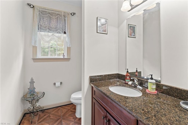 2234 Creekway Dr, Smithfield, VA 23430 - bathroom with toilet, vanity, and baseboards