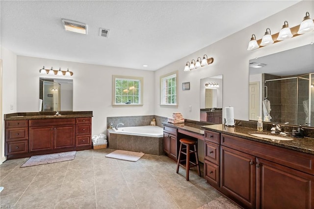 2234 Creekway Dr, Smithfield, VA 23430 - bathroom with a shower stall, a bath, tile patterned floors, a textured ceiling, and two vanities