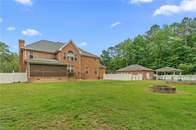 2234 Creekway Dr, Smithfield, VA 23430 - back of house featuring an outdoor fire pit, brick siding, a gazebo, a sunroom, and a chimney